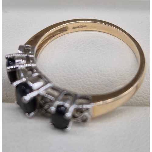 25 - 9ct yellow gold Sapphire and Diamond stone ring. Three oval cut sapphires and eight small round cut ... 