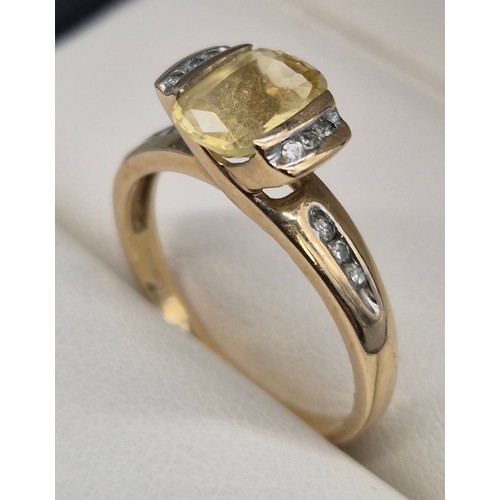 24 - 9ct yellow gold, Citrine and Diamond stone ring. 2.58grams. Ring size P. Having 12 round cut diamond... 