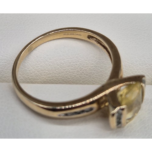 24 - 9ct yellow gold, Citrine and Diamond stone ring. 2.58grams. Ring size P. Having 12 round cut diamond... 