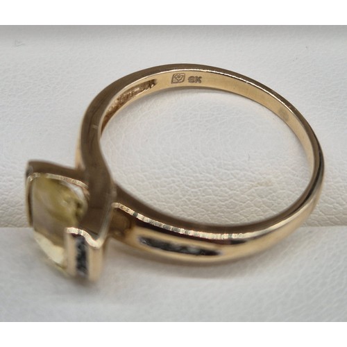 24 - 9ct yellow gold, Citrine and Diamond stone ring. 2.58grams. Ring size P. Having 12 round cut diamond... 