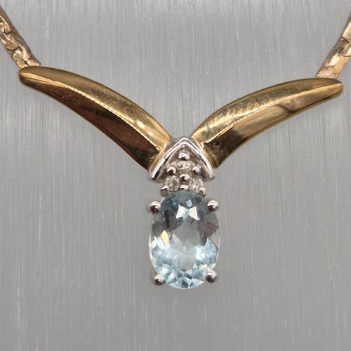 6 - 9ct yellow gold, diamond and blue topaz gem stone necklace. 5.60grams.