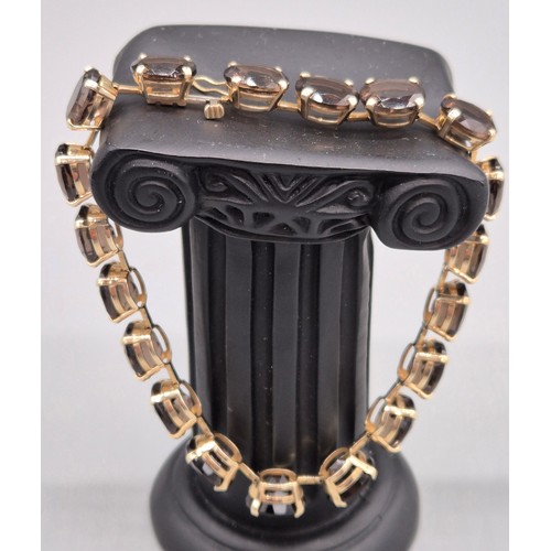 4 - 9ct yellow gold and smokey Quartz stone bracelet. 19.5cm length. 17grams.