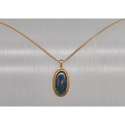 41 - 9ct yellow gold chain together with a 9ct yellow gold and fire opal gem stone pendant. 5.73grams