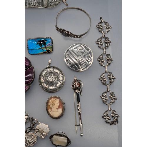 49 - A Collection of silver jewellery; 925 silver Indian bracelet. various rings, Enamel and silver souve... 