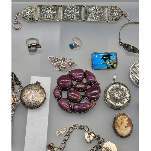 49 - A Collection of silver jewellery; 925 silver Indian bracelet. various rings, Enamel and silver souve... 
