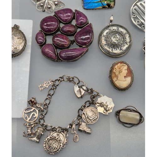 49 - A Collection of silver jewellery; 925 silver Indian bracelet. various rings, Enamel and silver souve... 