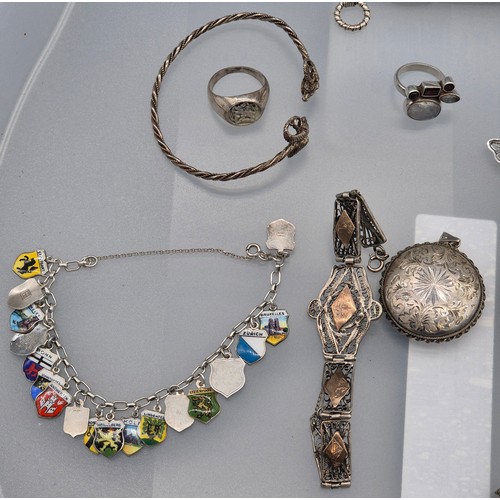 49 - A Collection of silver jewellery; 925 silver Indian bracelet. various rings, Enamel and silver souve... 