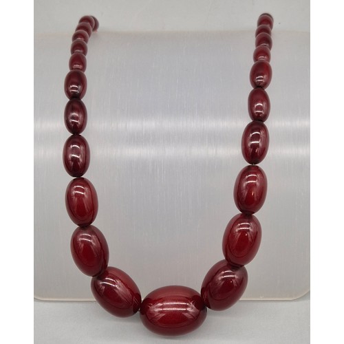 47 - Vintage Cherry Amber Graduating bead necklace. 49.79grams.