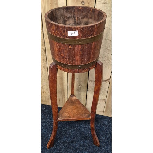 258 - Antique barrel plant stand. 91cm high.