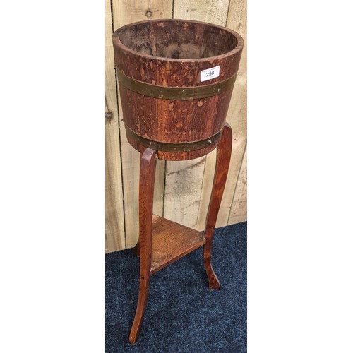 258 - Antique barrel plant stand. 91cm high.