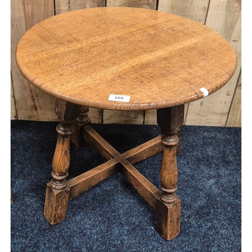 259 - Antique oak barrel top side table. Together with an oak school desk. Barrel top table- 47cm high.