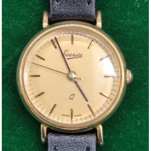 53 - 9ct yellow gold cased Everite Quartz ladies watch. Fitted with a leather strap.