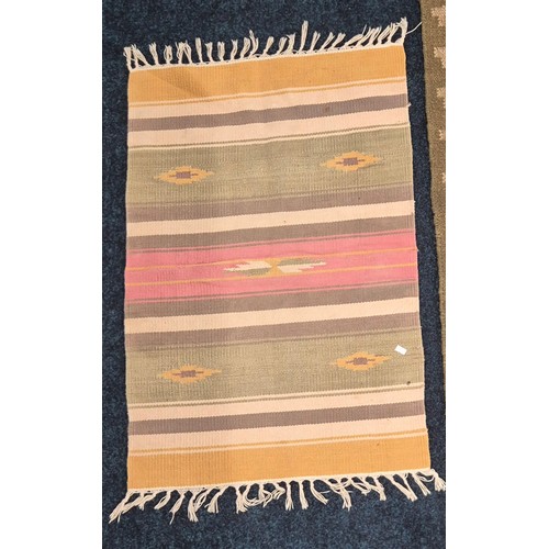 278 - Hand knotted kilim runner rug in a green ground and three smaller hand made rugs. Runner- 200x70cm