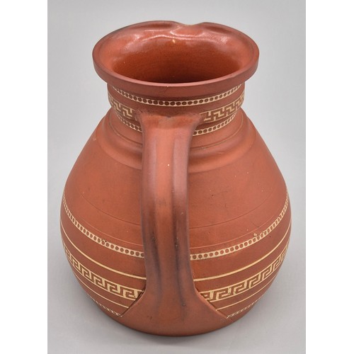 279 - 19th century Wedgwood terracotta water jug. Having a Greek key band design. 14.5cm high.