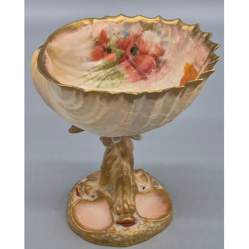 284 - Scottish Nautilus pottery shell design fruit bowl. raised with a stem made from porcelain fish and h... 