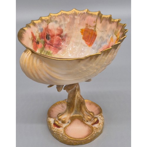 284 - Scottish Nautilus pottery shell design fruit bowl. raised with a stem made from porcelain fish and h... 