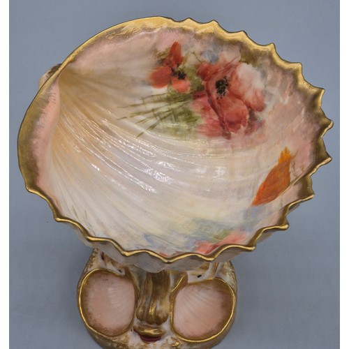 284 - Scottish Nautilus pottery shell design fruit bowl. raised with a stem made from porcelain fish and h... 