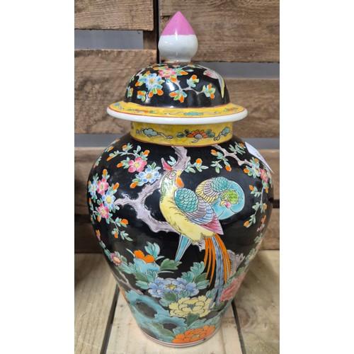 303 - A Pair of Antique Chinese lidded urns, possibly used for Ginger. Hand painted with a floral and bird... 