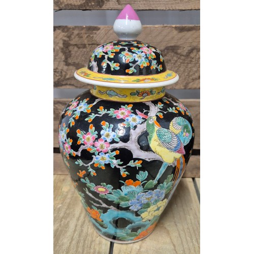 303 - A Pair of Antique Chinese lidded urns, possibly used for Ginger. Hand painted with a floral and bird... 