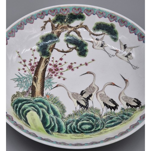 313 - Large Chinese Famille Rose wall charger. Designed with cranes. 36.5cm diameter. Stamp signature to t... 