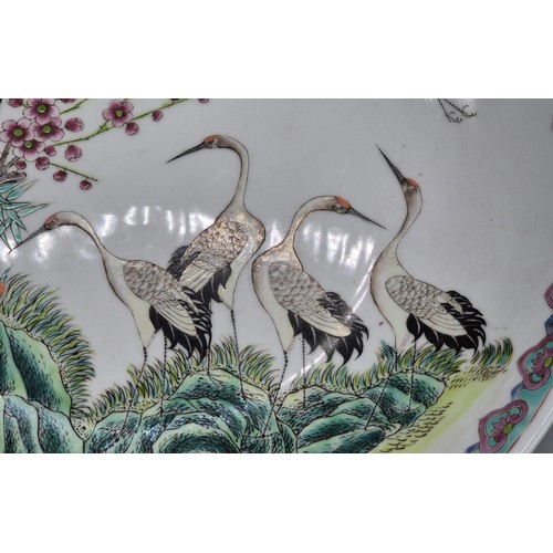 313 - Large Chinese Famille Rose wall charger. Designed with cranes. 36.5cm diameter. Stamp signature to t... 