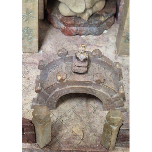 316 - Large antique Chinese soapstone temple carving. Raised on a wooden base. Buddha praying sat to the i... 