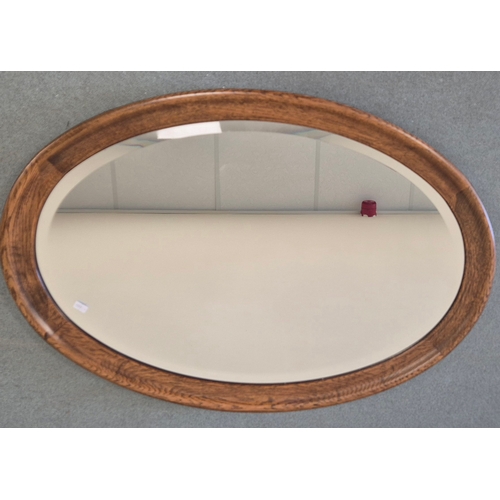 375 - Late 19th century Oak framed oval mirror. 56x83cm.