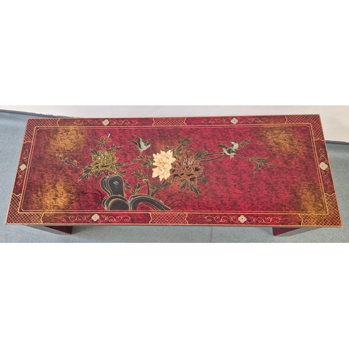 373 - Heavy Chinese Red lacquered coffee table. Designed with gilt hand painted trims and floral design. 4... 