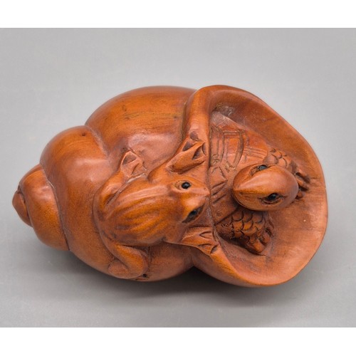 88 - Japanese hand carved boxwood netsuke sculpture of turtle within a shell and the frog resting on the ... 