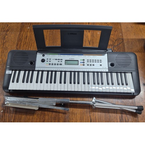 329 - Yamaha YPT-255 Electric keyboard together with music sheet Foldable stand