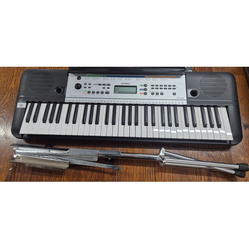 329 - Yamaha YPT-255 Electric keyboard together with music sheet Foldable stand