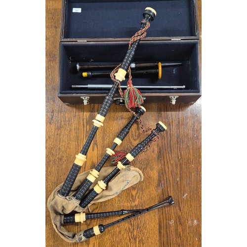 331 - Antique bagpipes by Jim. Tweedle of Inveran. Comes with carry case, Practice chanter and two other i... 