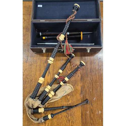 331 - Antique bagpipes by Jim. Tweedle of Inveran. Comes with carry case, Practice chanter and two other i... 