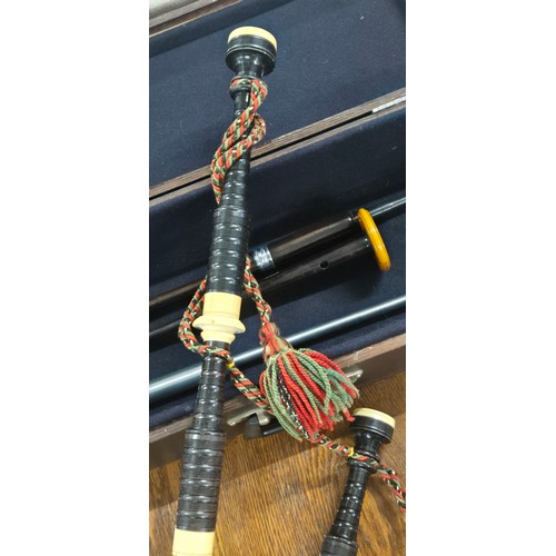 331 - Antique bagpipes by Jim. Tweedle of Inveran. Comes with carry case, Practice chanter and two other i... 