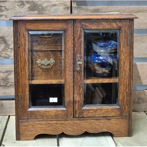 255A - Antique Smokers cabinet containing a Scottish tobacco jar with lid. Comes with key.