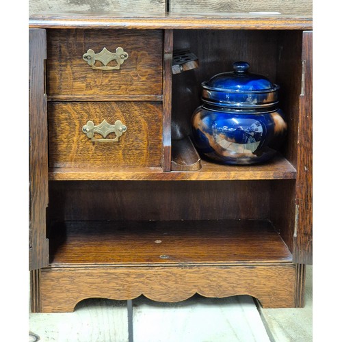 255A - Antique Smokers cabinet containing a Scottish tobacco jar with lid. Comes with key.