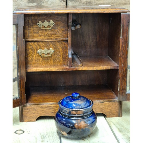 255A - Antique Smokers cabinet containing a Scottish tobacco jar with lid. Comes with key.