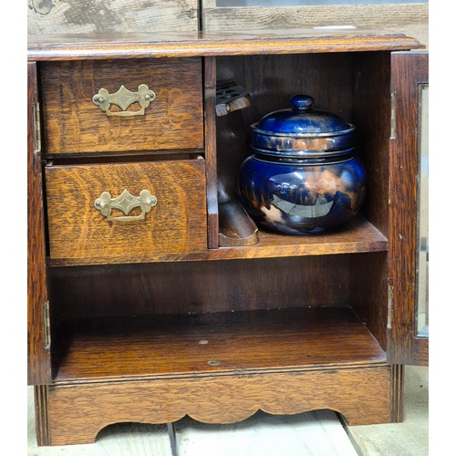 255A - Antique Smokers cabinet containing a Scottish tobacco jar with lid. Comes with key.