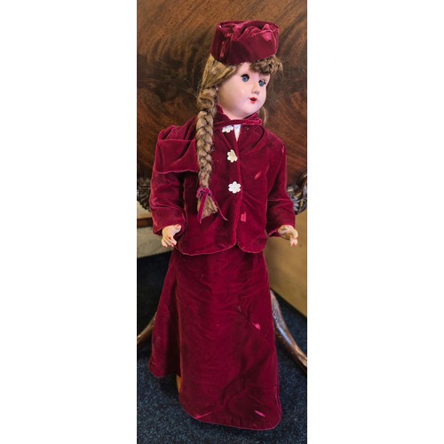 655 - Large German Victorian doll with stand. Having a red velvet dress. Having movable limbs and eyes. 80... 