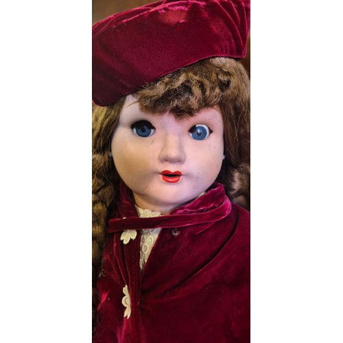 655 - Large German Victorian doll with stand. Having a red velvet dress. Having movable limbs and eyes. 80... 
