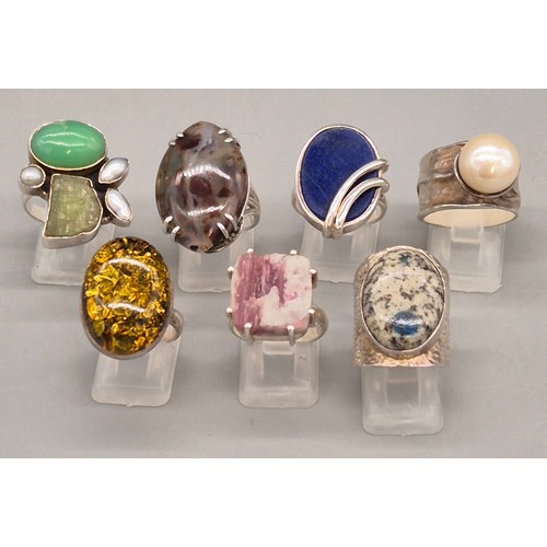 69 - A Collection of seven Silver and gem stone rings; Amber, Lapis Lazuli, Agate, Pearl and quartz stone... 