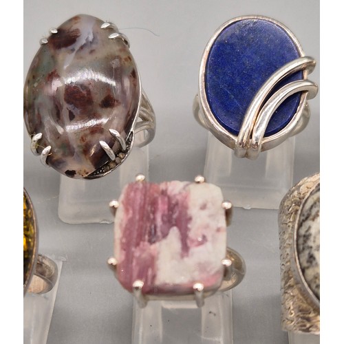69 - A Collection of seven Silver and gem stone rings; Amber, Lapis Lazuli, Agate, Pearl and quartz stone... 