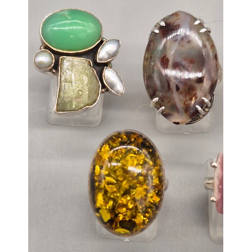 69 - A Collection of seven Silver and gem stone rings; Amber, Lapis Lazuli, Agate, Pearl and quartz stone... 