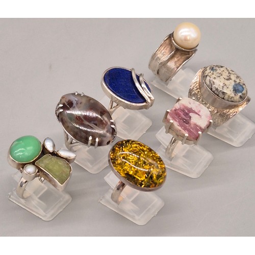 69 - A Collection of seven Silver and gem stone rings; Amber, Lapis Lazuli, Agate, Pearl and quartz stone... 