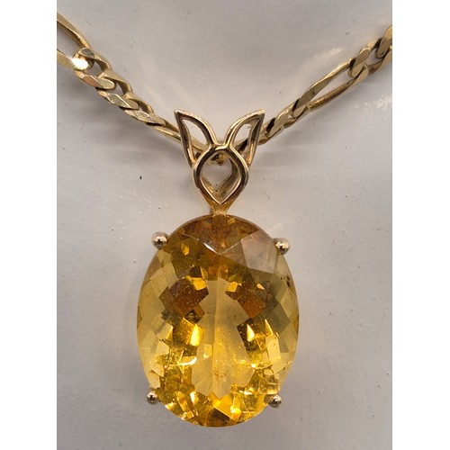 75 - 9ct yellow gold curb chain together with a 10ct yellow gold and oval cut Citrine Gem Stone Pendant. ... 