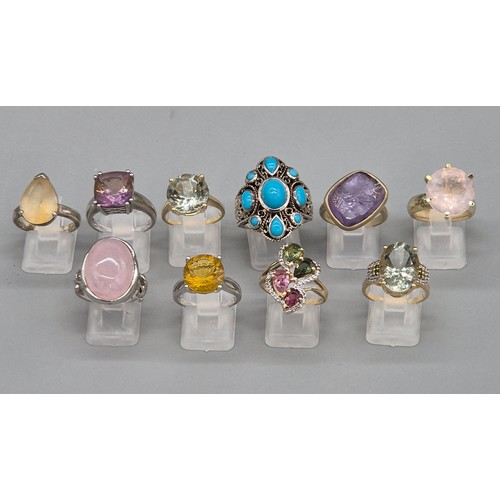 72 - A Collection of 10 Silver and Gem stone rings; Pink Quartz, Amethyst, Quartz and blue stone rings.