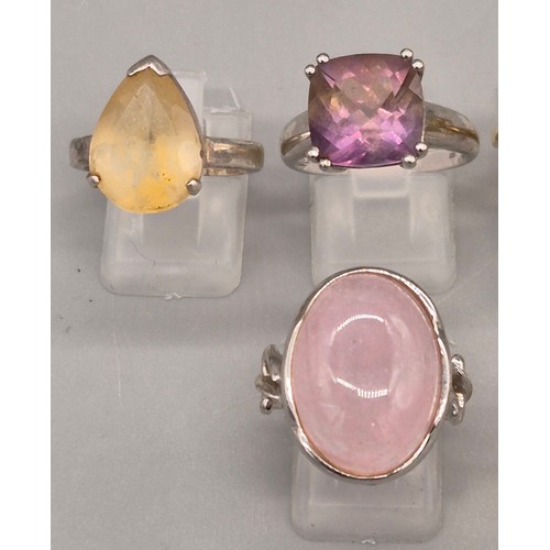 72 - A Collection of 10 Silver and Gem stone rings; Pink Quartz, Amethyst, Quartz and blue stone rings.