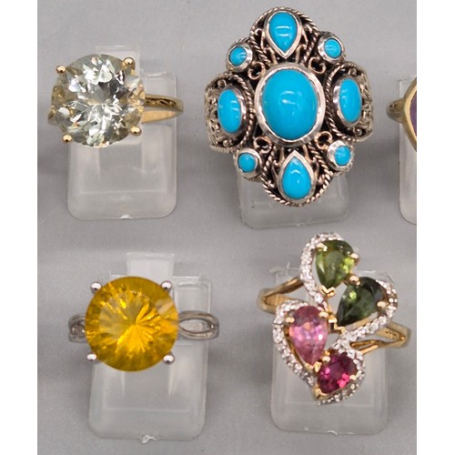 72 - A Collection of 10 Silver and Gem stone rings; Pink Quartz, Amethyst, Quartz and blue stone rings.