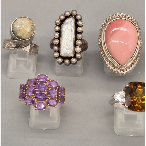 79 - A Collection of eight silver and gem stone rings; Pink Quartz, Pearl, Agate and Amethyst stones.