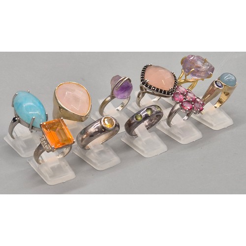 74 - A Collection of 10 Silver and Gem stone rings; Pink and Blue Quartz stones.